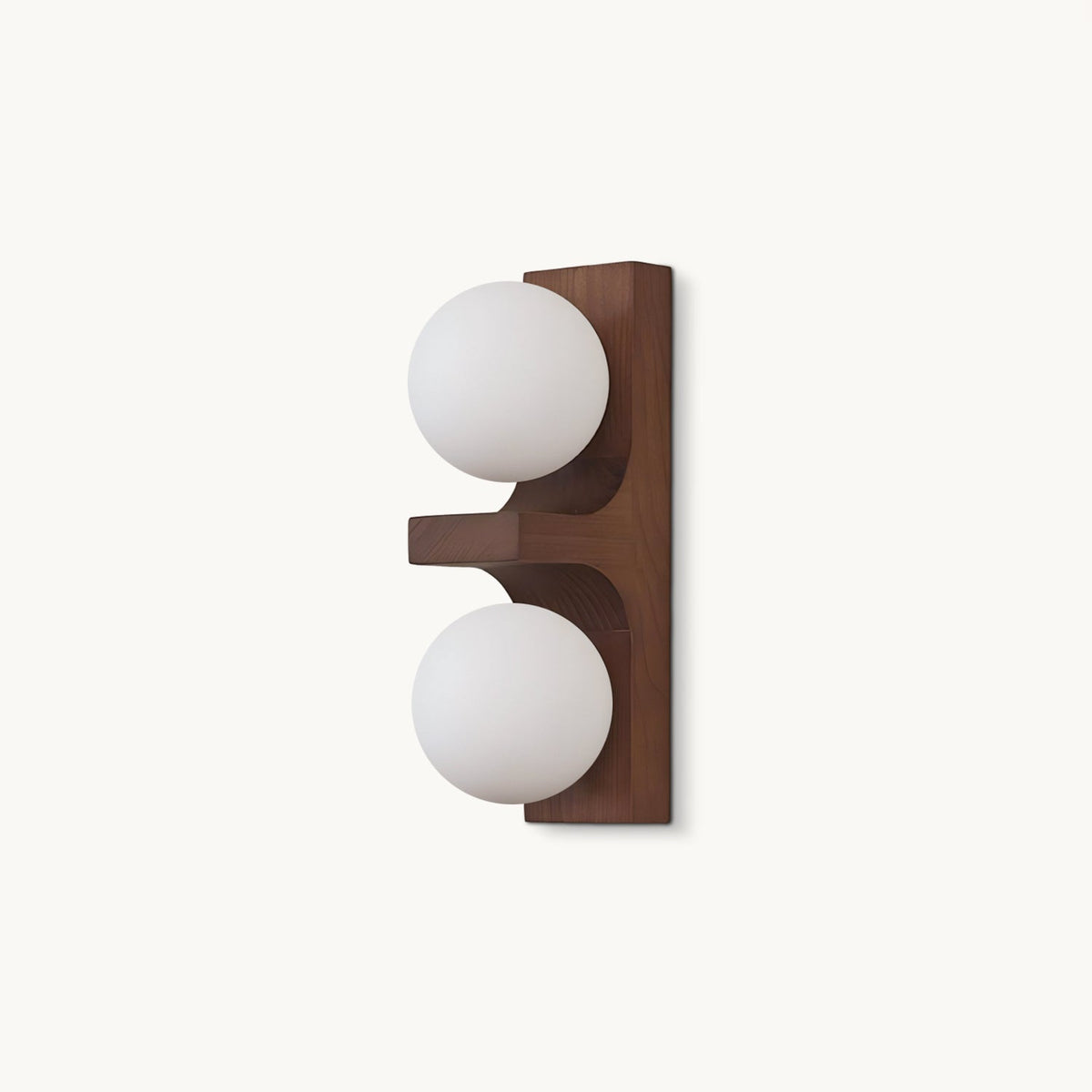 On a plain white backdrop, a compact Clérachic wall light with a walnut-coloured wood backplate and two round frosted white glass globes.