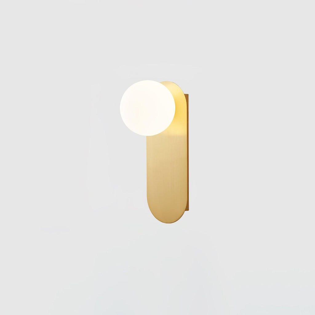Smaller view of the brass globe wall light from Clérachic, its white globe and rounded plate on a pale grey background.