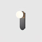 Black brushed plate with a white globe, this Clérachic wall light shown on a pale grey background.