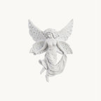 This Clérachic white resin wall light in its butterfly-winged fairy shape, shown unlit on a plain white backdrop.