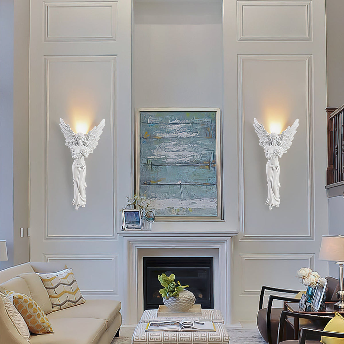 A pair of Clérachic standing-angel wall lights, lit, either side of a blue abstract painting above a white fireplace.