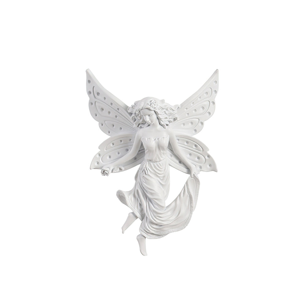Fairy-shaped Clérachic wall light on a white backdrop, angled to show its butterfly wings and flowing skirt.