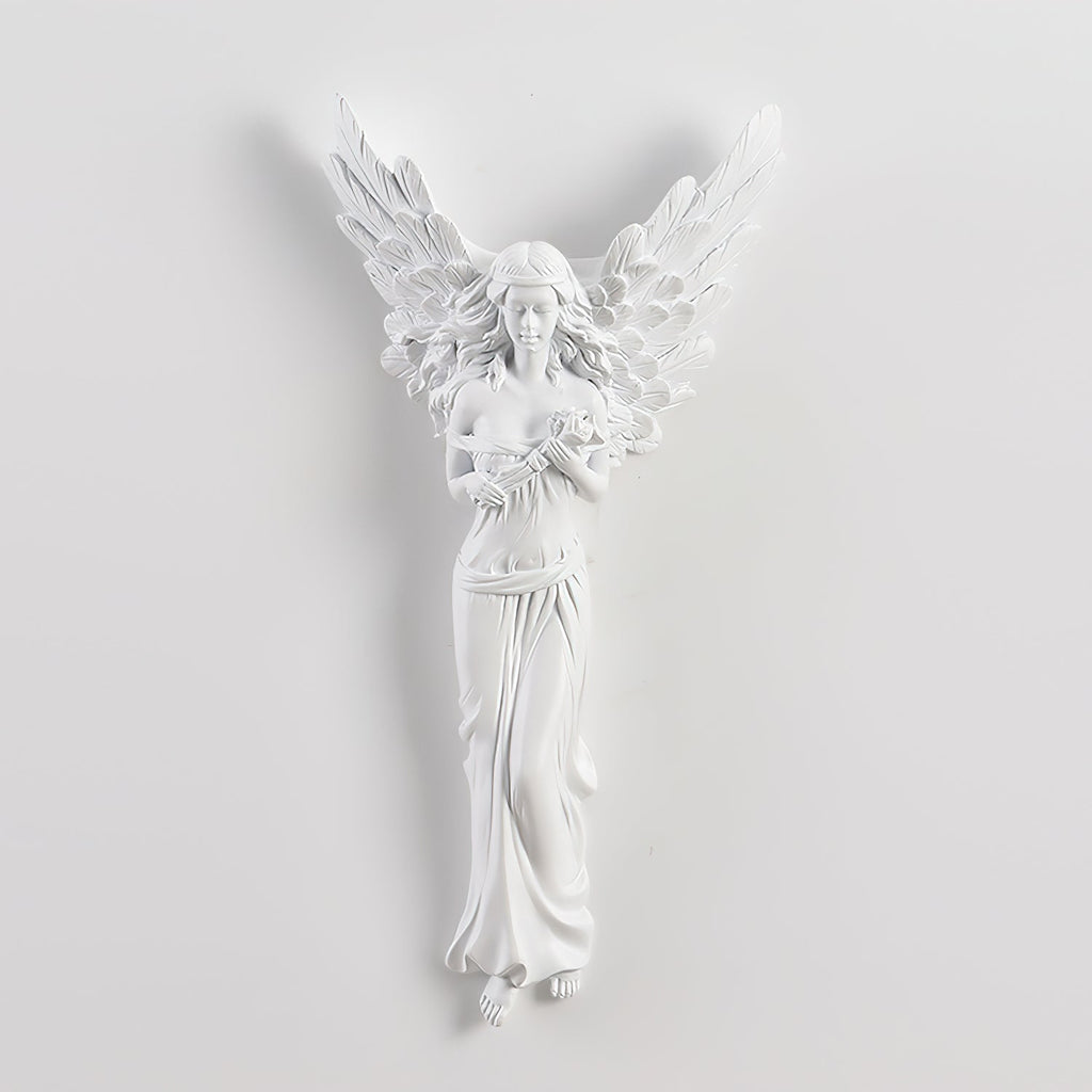Unlit standing-angel Clérachic wall light on a pale wall, showing its feathered wings and long draped gown.