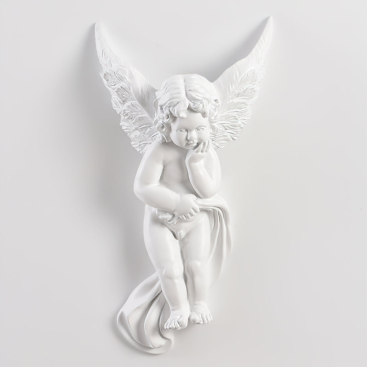 Unlit cherub Clérachic wall light on a pale wall, the figure resting its chin on its hand with cloth draped below.