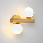 Horizontal wooden rod on this Clérachic wall sconce, with a lit globe above it and another below, in a cool grey setting.