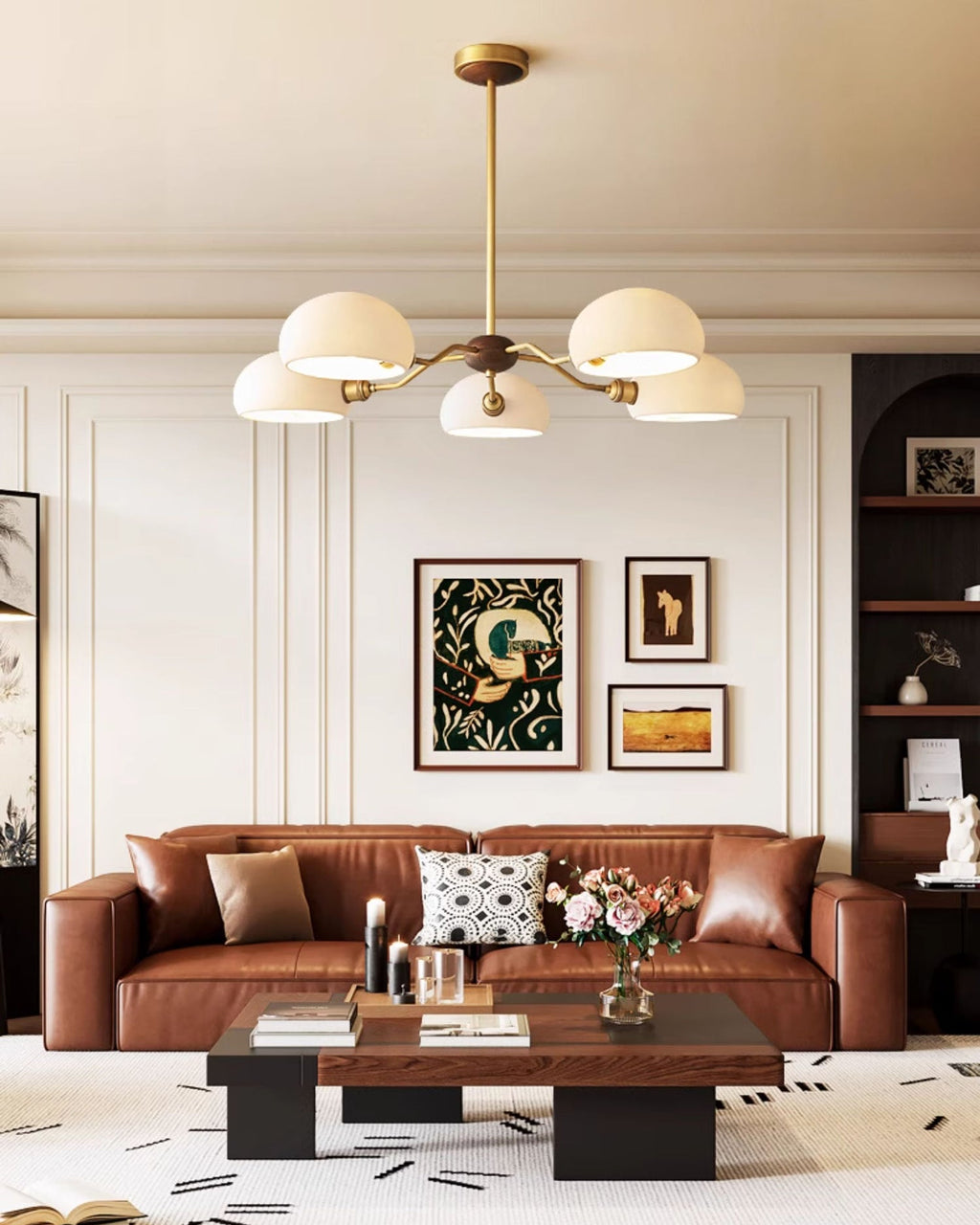 Taller view of this Clérachic chandelier over a brown leather sofa and a low black coffee table, with arched shelves behind.