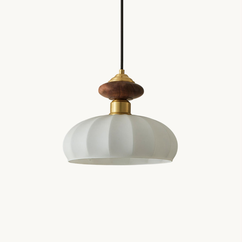 A Clérachic pendant with a ribbed white glass shade, walnut-toned wooden knob and brass collar, on a plain off-white backdrop.