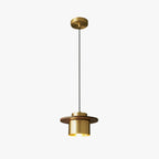 Clérachic pendant with a brass canopy, a long black cord and a walnut-brimmed brass shade, on a plain white background.
