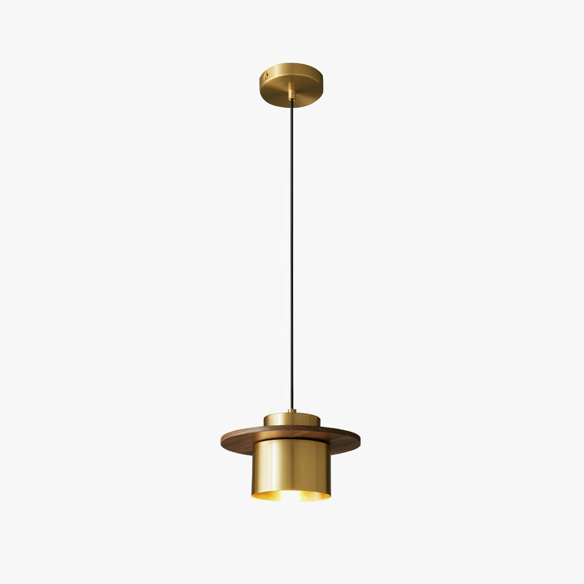 Clérachic pendant with a brass canopy, a long black cord and a walnut-brimmed brass shade, on a plain white background.