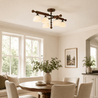 Larger Clérachic semi flush light in a bright room with tall windows and a round table with cream chairs.