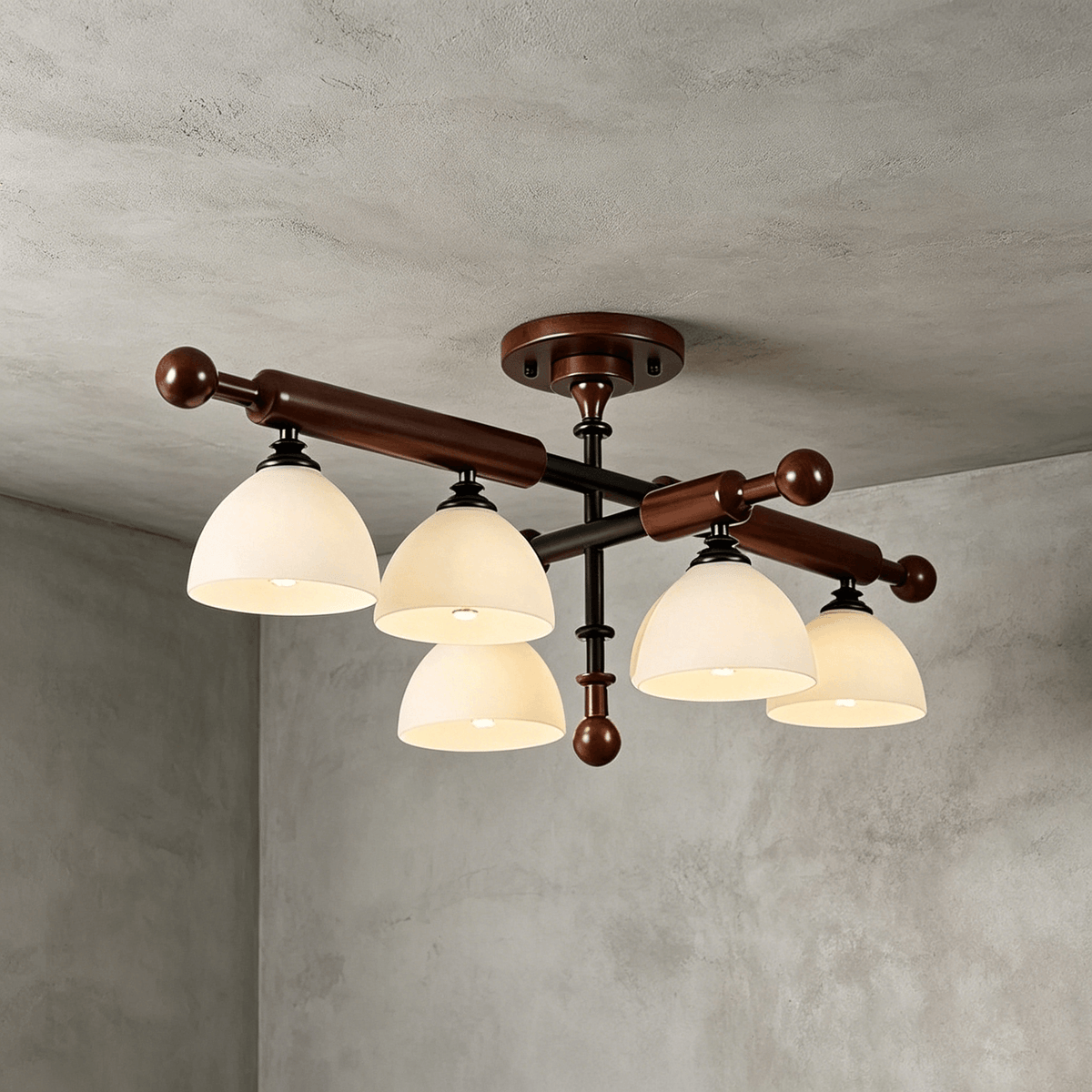 Five frosted glass shades hang below walnut-finished wood bars on this Clérachic semi flush light, against grey plaster.