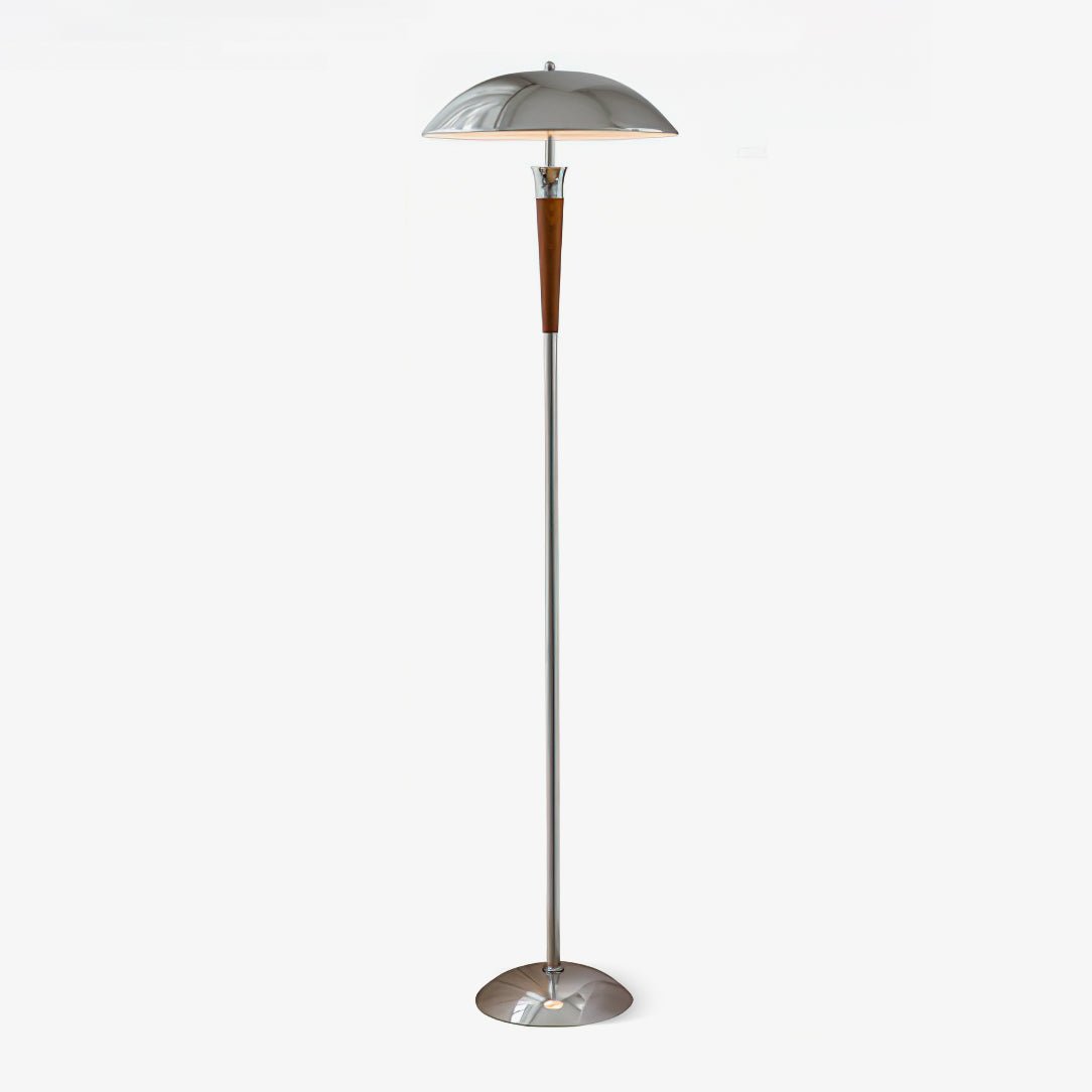 A Clérachic floor lamp with a domed chrome shade, walnut tapered stem and chrome base, lit on a plain white backdrop.