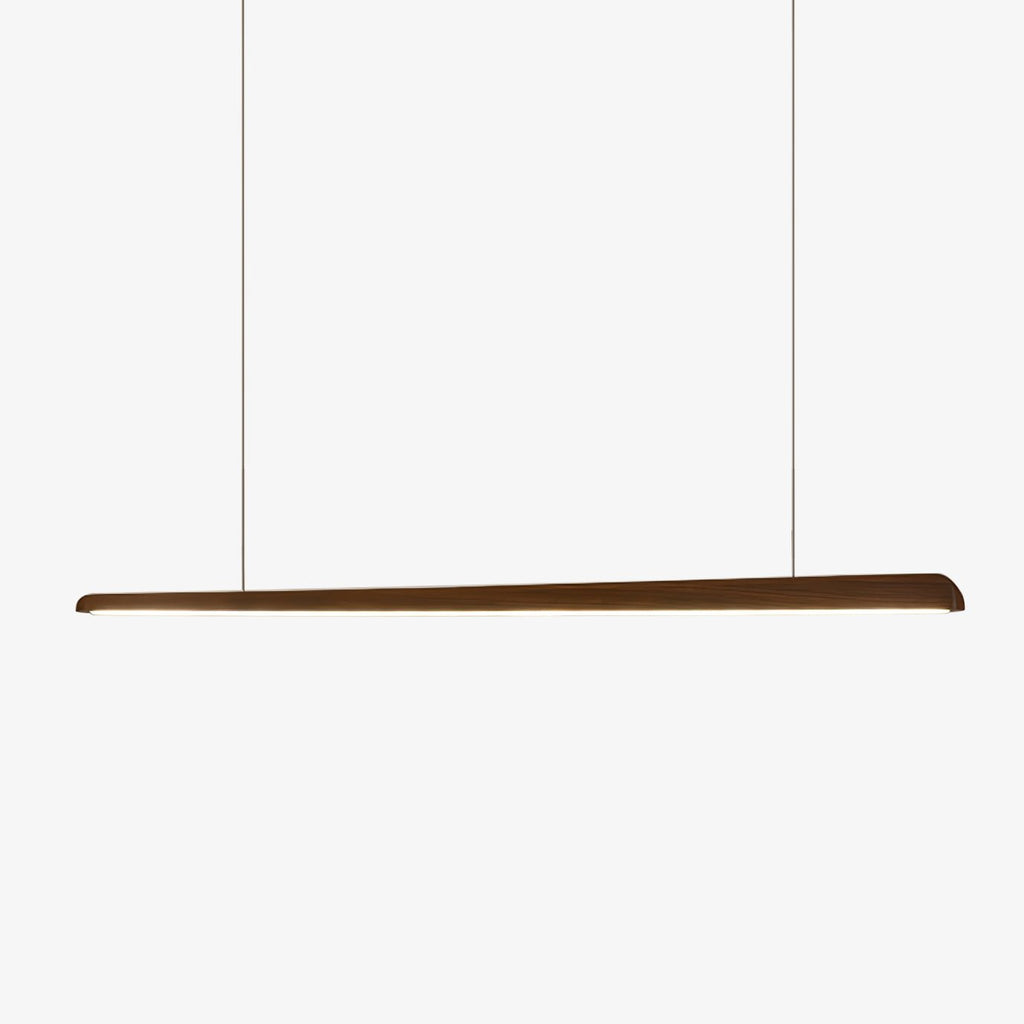 Slim tapered walnut bar pendant hung on two fine suspension wires against a plain white backdrop, from Clérachic.