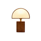 A Clérachic table lamp with a half-round white shade and a walnut block base, shown on a plain white background.