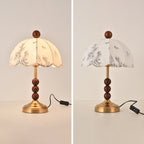 Two views of this Clérachic lamp with a brass foot and wooden bead stem, one lit and one unlit, with the black switch cord.