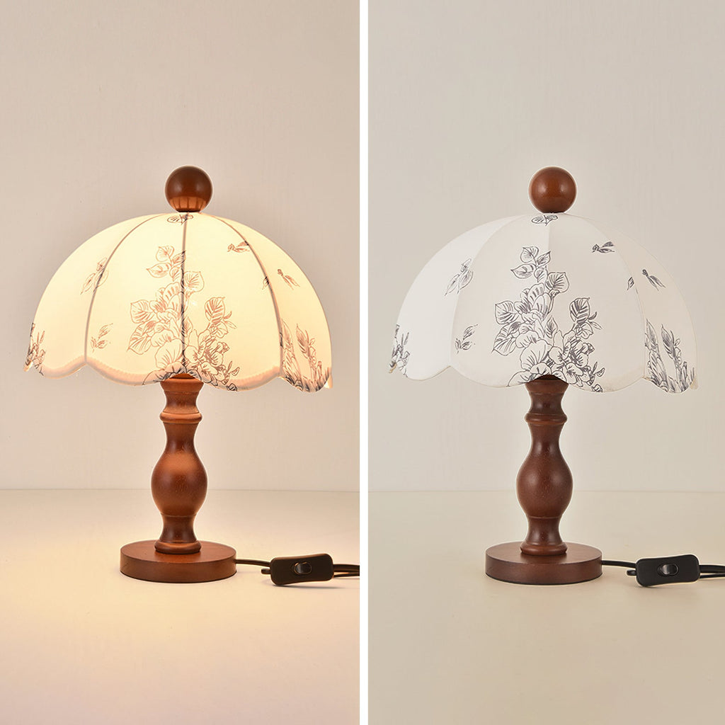Two views of this Clérachic lamp with a turned wooden base, lit and unlit, showing the floral print and the in-line switch.