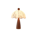 This Clérachic table lamp with a tapered wooden base and a scalloped floral shade, on a white background.