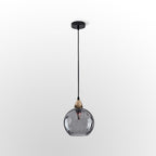 Full-drop studio view of the smoke gray Clérachic water ripple glass globe pendant, black cord and flat black ceiling rose above.