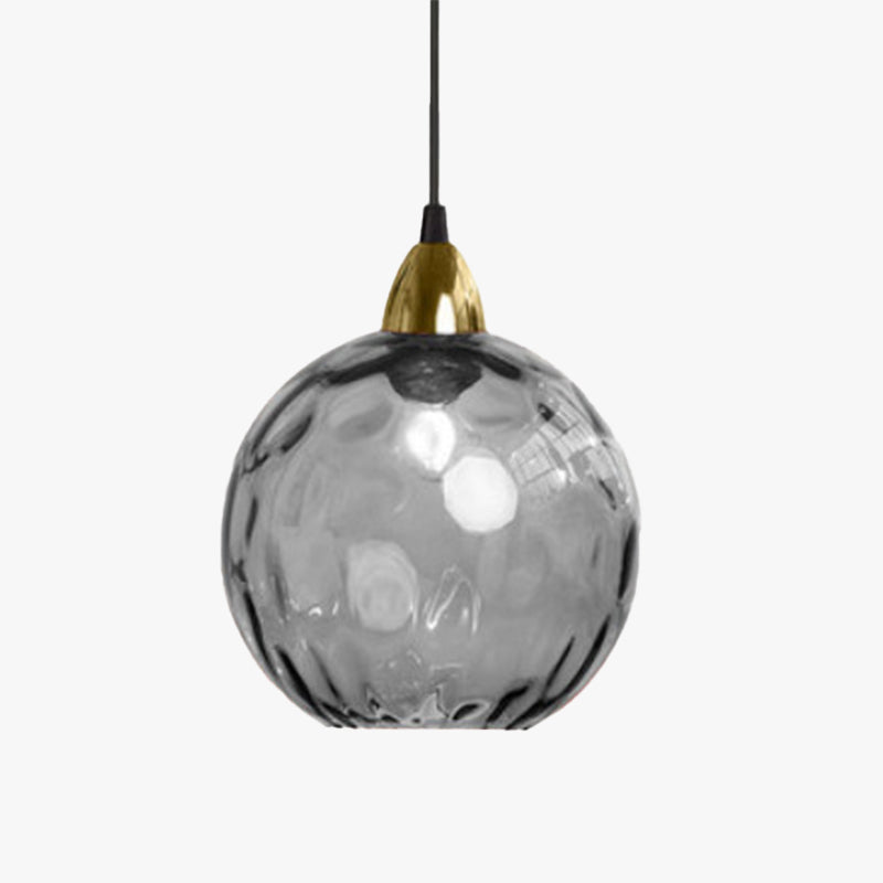 The Clérachic water ripple glass globe pendant in smoke gray, gold socket cup and black cord shown against a white ground.