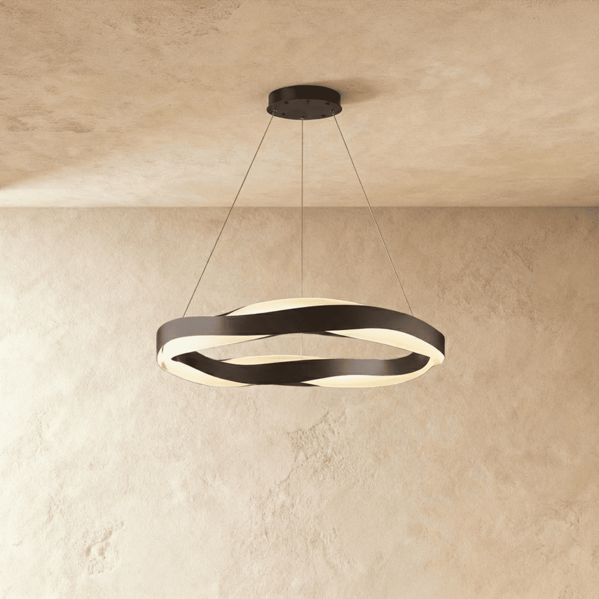 Clérachic wide round LED chandelier in black, its two wavy bands glowing softly under a plaster ceiling.