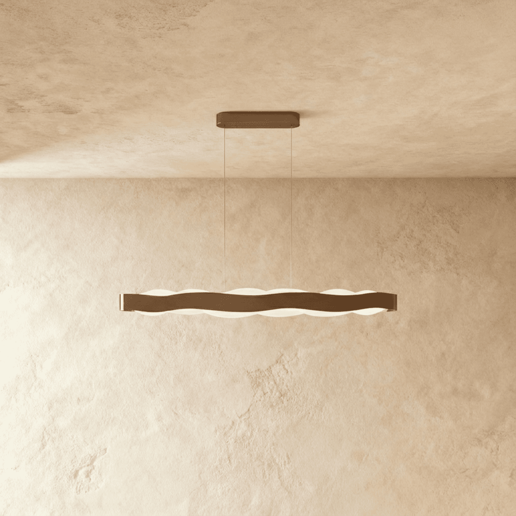 Clérachic linear wavy LED pendant in a bronze-toned finish, hung on two fine cables with an oblong ceiling plate.