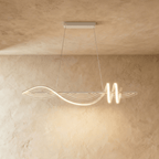 Clérachic white linear pendant, a flowing wave of LED light ending in a double loop, hung on slim cables from a flat canopy.
