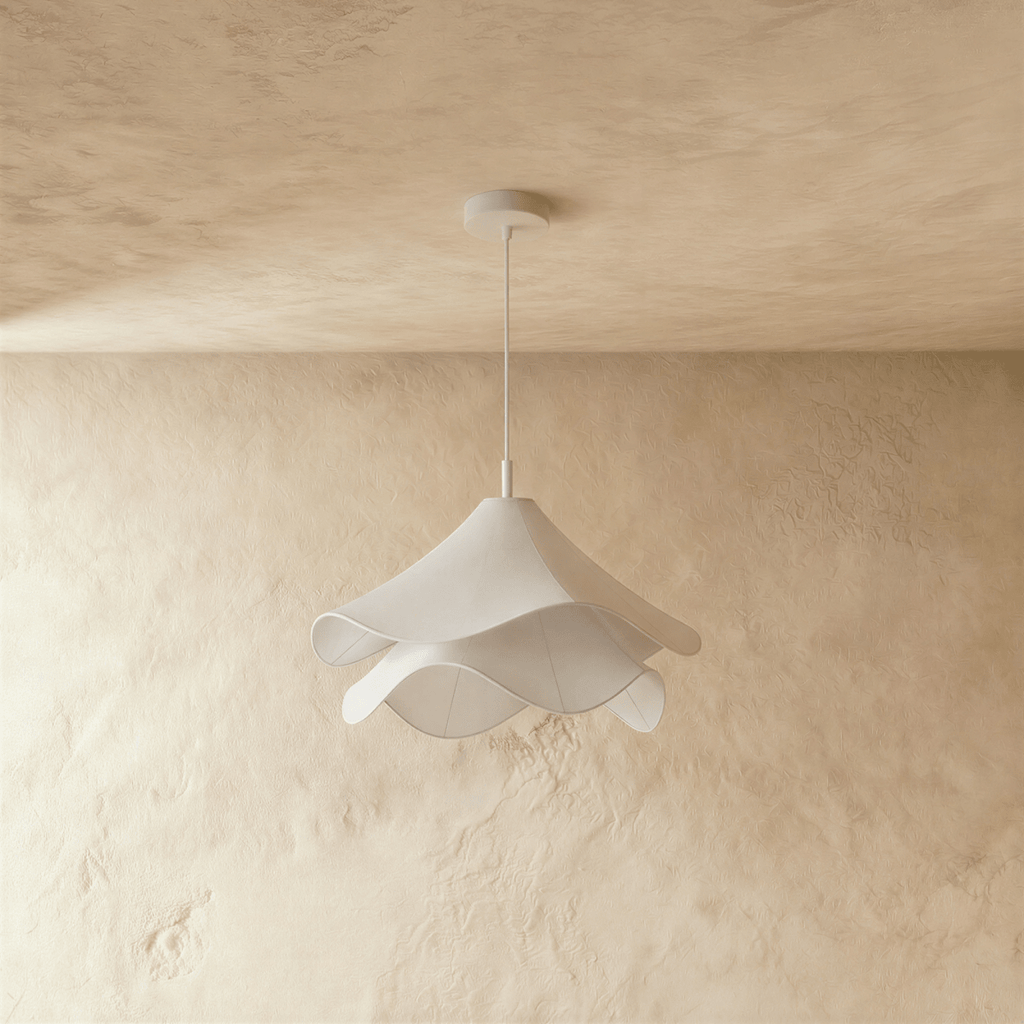 Clérachic unlit white fabric pendant with two rippling layers on a white canopy and stem, in front of limewash.