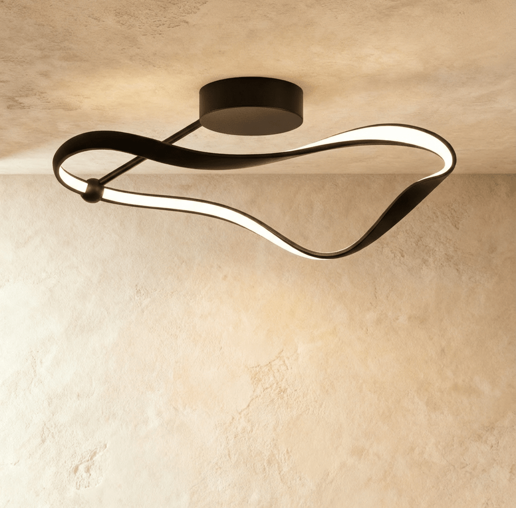 Clérachic longest black ribbon ceiling light, its curved aluminium band lit with a soft LED glow beneath a round canopy.