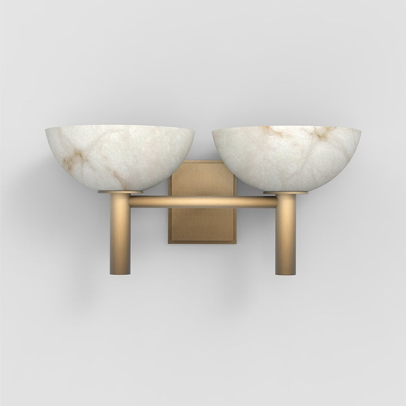 The Clérachic Weft sconce seen straight on, showing the veined alabaster bowls and the squared brass wall plate.
