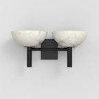 The Clérachic Weft sconce in black, angled to show how little the bracket projects from the wall.