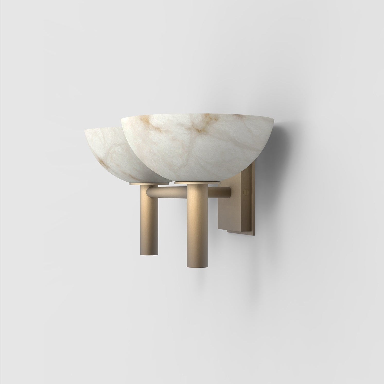 Clérachic Weft sconce in brass at a tighter angle, its shadow marking the shallow depth of the bracket.
