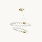 A Clérachic chandelier with two spiralling rings of white globes joined by brass spheres, on a plain off-white backdrop.