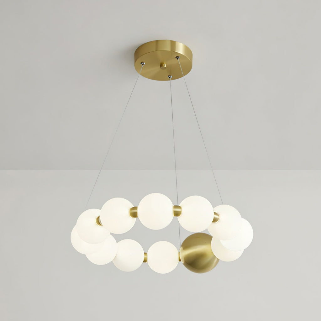 A compact Clérachic chandelier with a double-turn ring of lit globes, under a round brass ceiling plate.