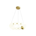 A smaller Clérachic chandelier of white globes arranged in a double ring, on a plain white backdrop.