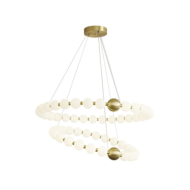 Another two-ring Clérachic chandelier on white, its globe spirals falling in two loops from a round brass canopy.