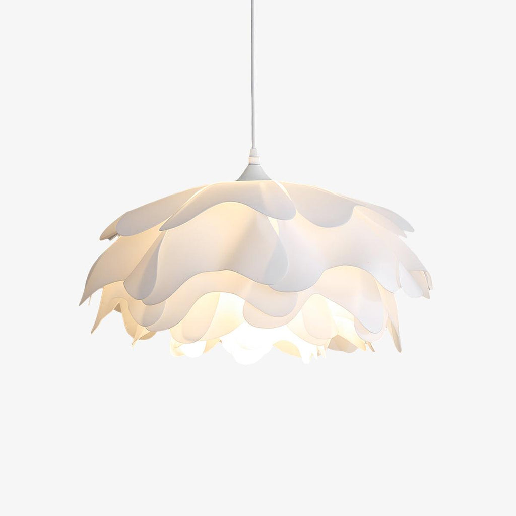 Cut-out view of this Clérachic petal pendant on a pale backdrop, with its tiers of white acrylic lit from within.
