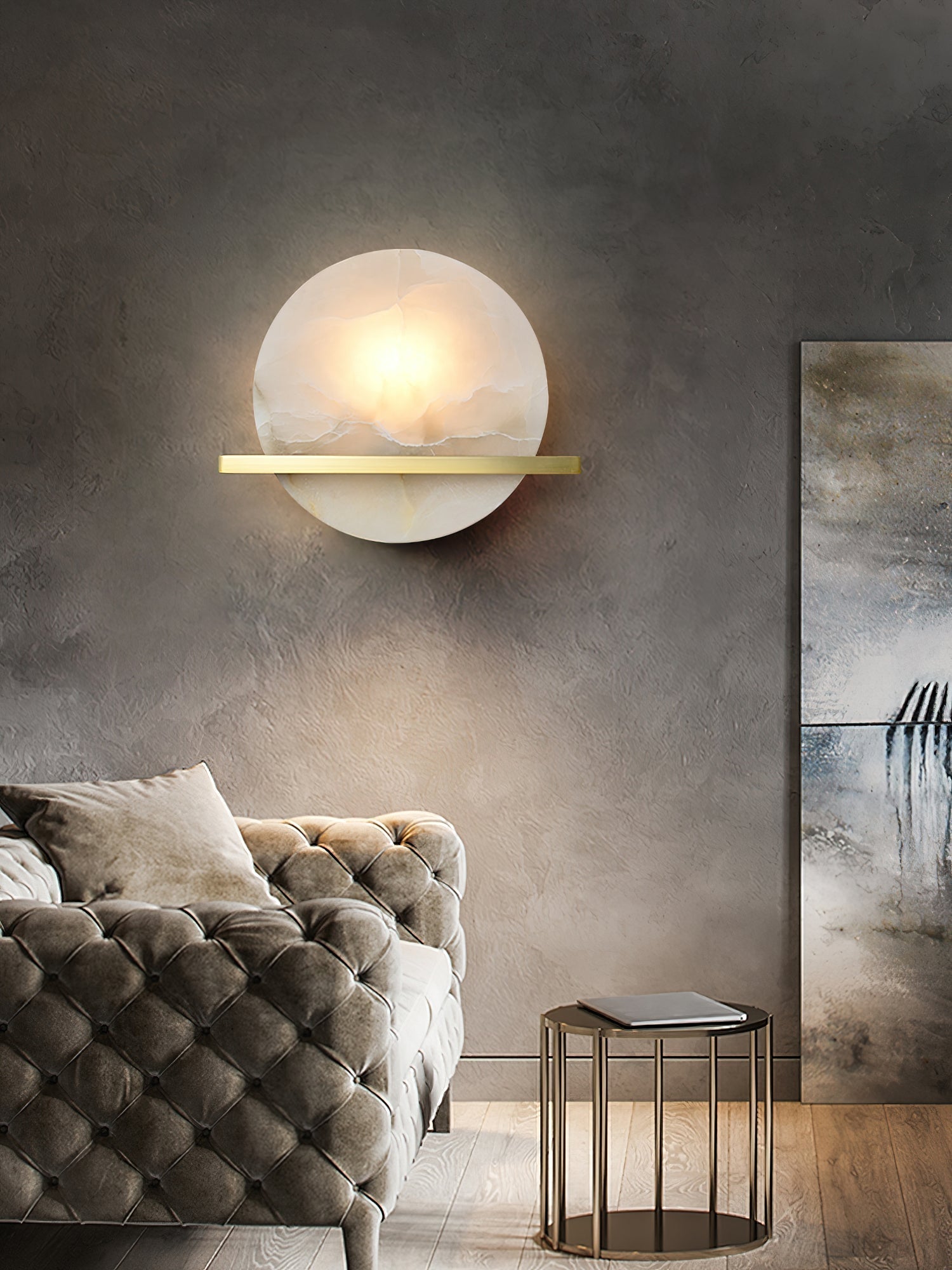 Clérachic White Alabaster Wall Sconce warming a dark plaster wall above a tufted velvet sofa, brass bar catching the light.