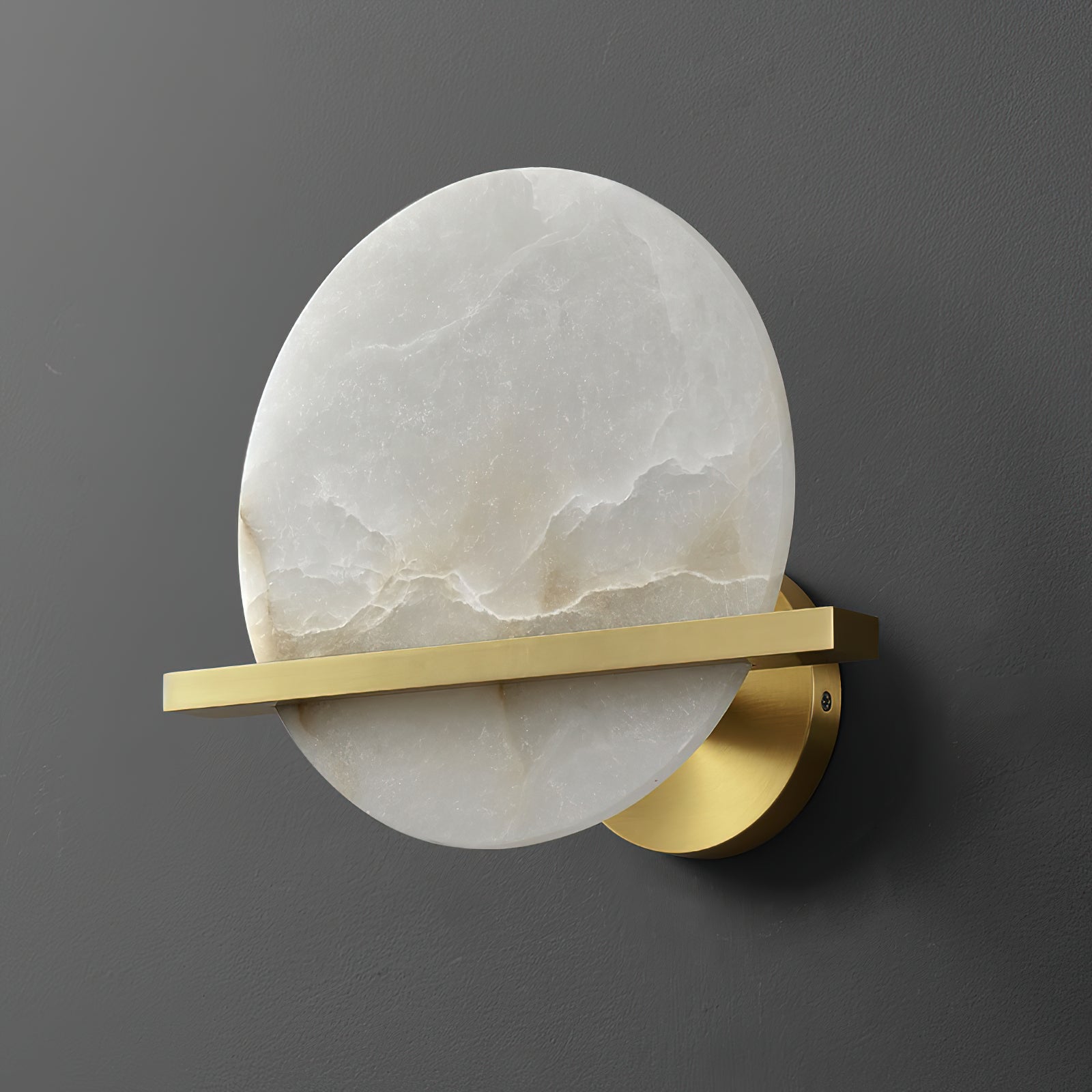 Clérachic White Alabaster Wall Sconce switched off, seen at an angle so the natural veining and the flat brass bar read clearly.