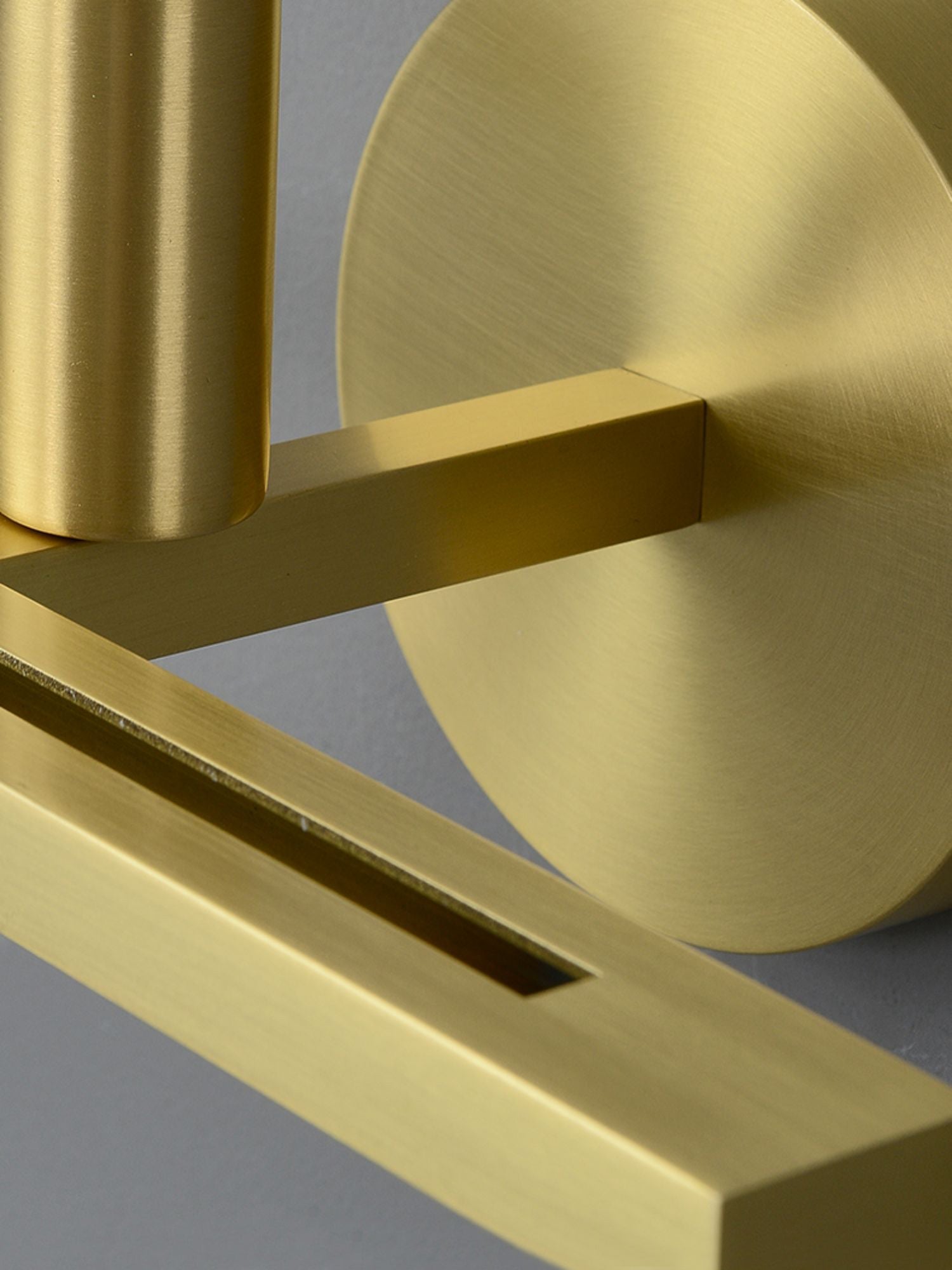Close-up of the Clérachic White Alabaster Wall Sconce brass hardware — brushed canopy, flat crossbar and the cylindrical socket.