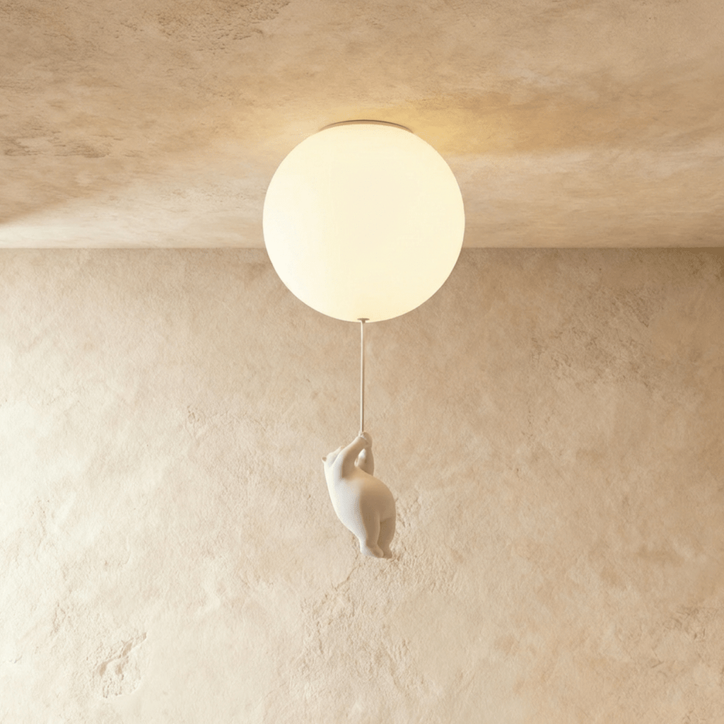 Clérachic ceramic bear climbs toward a glowing frosted glass globe mounted flush to a textured plaster ceiling.
