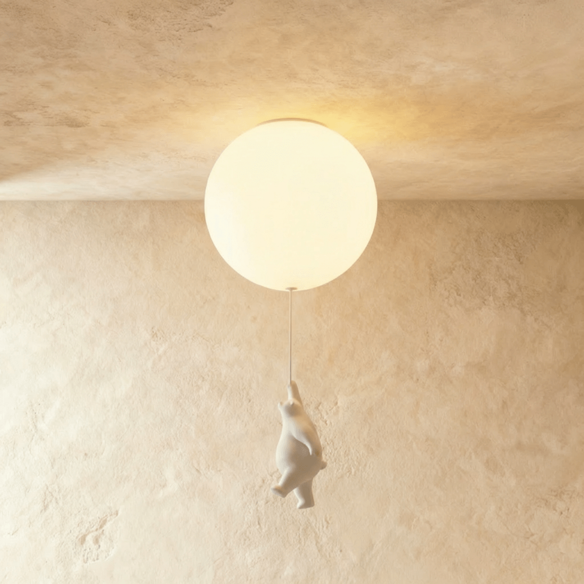 Clérachic bear balloon flush-mount light shows the figurine mid-climb beneath a single glowing glass globe.