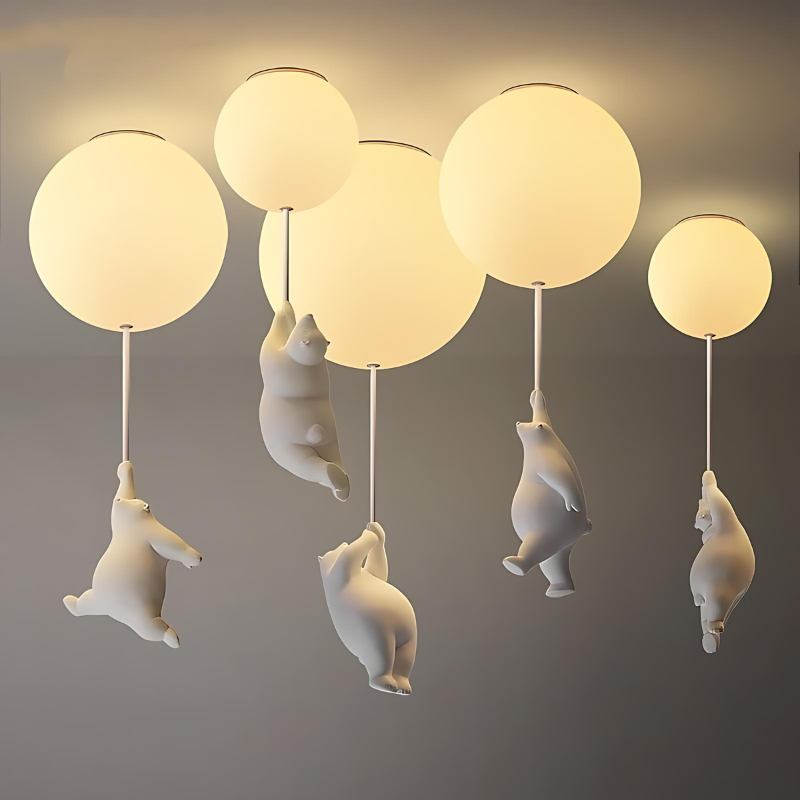 Clérachic bear balloon lights shown in five sizes together, each frosted glass globe paired with a bear figurine.