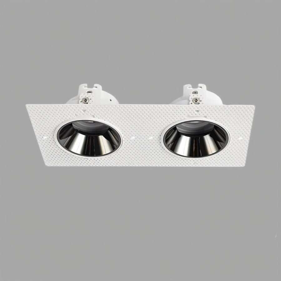 Clérachic double trimless downlight with two chrome cones set in one white plaster-in plate, angled to show both openings.