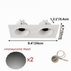 Clérachic double trimless downlight in white paired with two honeycomb mesh inserts for its 24 cm plaster-in plate.