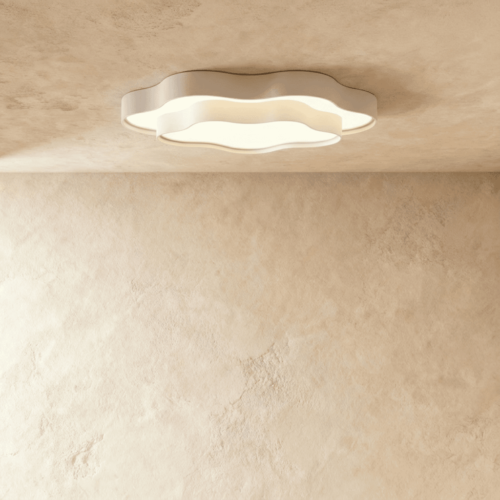 Clérachic white layered ceiling light with a scalloped cloud outline and frosted diffuser, lit on a limewash-textured ceiling.