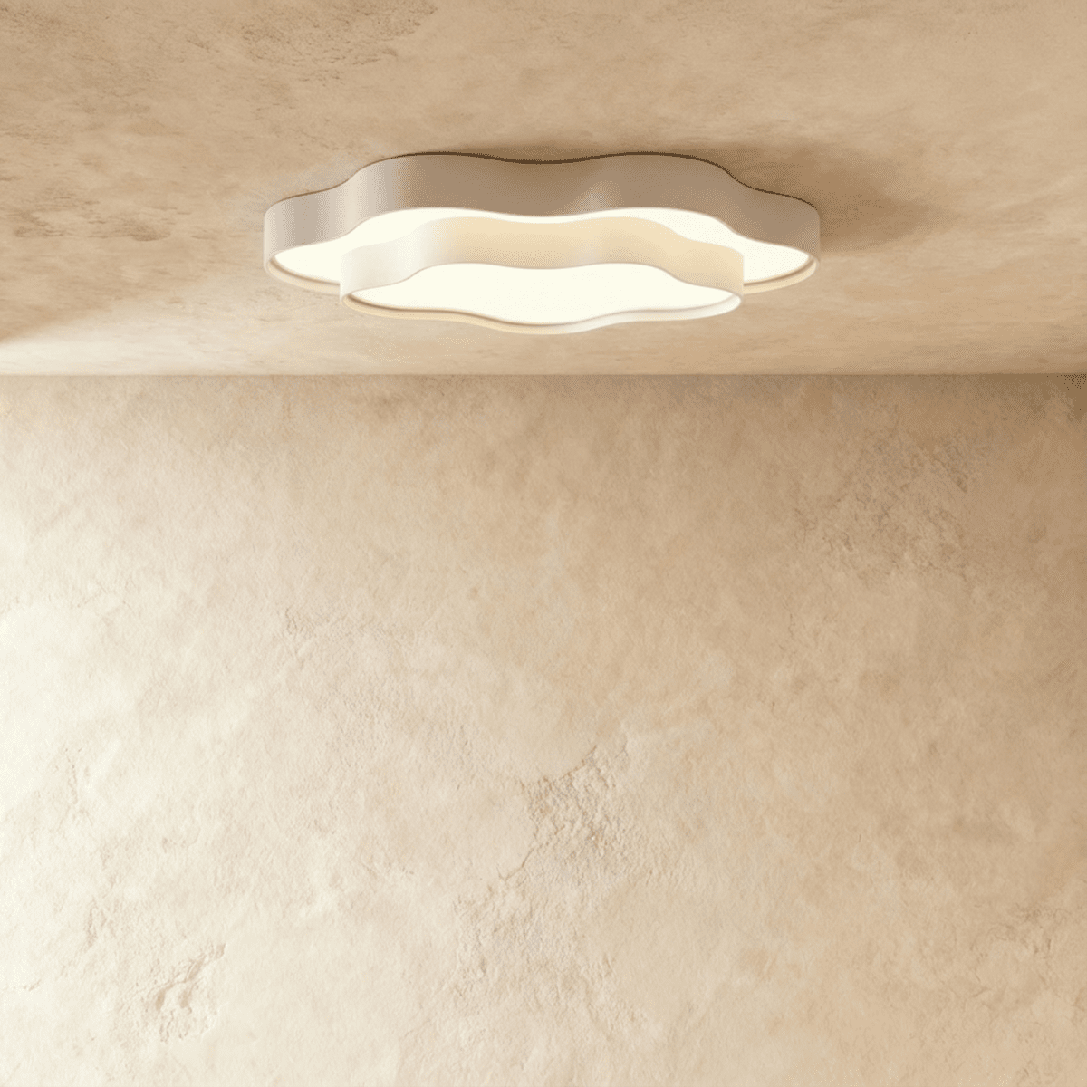 Clérachic white layered ceiling light with a scalloped cloud outline and frosted diffuser, lit on a limewash-textured ceiling.