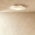 Clérachic white wavy-edged ceiling light with a soft frosted acrylic panel, mounted flat on a plaster-effect ceiling.