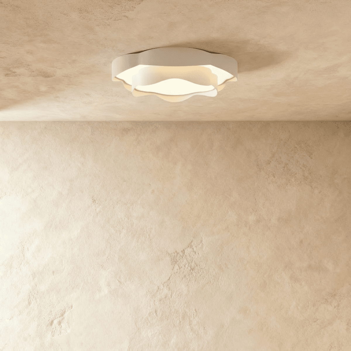 Clérachic compact ruffle-edged white ceiling light with a frosted diffuser, glowing softly on a textured plaster ceiling.