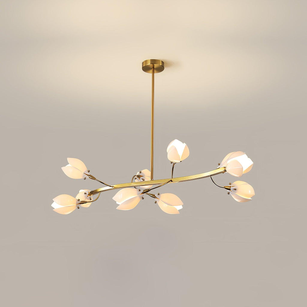 A Clérachic chandelier on a gold rod, with a flat curved arm of white petals, lit against a beige wall with a soft light glow above it.