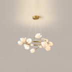 Clérachic ring chandelier lit against a beige wall, hanging on three fine cables from a round gold canopy, with white petal shades.